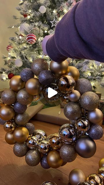 Vicki Collis on Instagram: "Make a bauble wreath with me ✨

You will need:
An old metal coat hanger
Baubles of your choice - preferably different sizes

To make your wreath, start by undoing your metal coat hanger and shaping it into a circle.
Then one by one add your baubles, use different sizes if possible! 
Keep going until you can’t add anymore, then fix the hanger back together and tada!

Hit save & let me know if you try it!

#diybaublewreath #baublewreath #diywreath #christmascrafts #christmascrafting #christmasdecorating #christmaswreaths #makeyourownchristmas #modernchristmas #modernchristmasdecor #wreathmaking" How To Make A Bauble Wreath, Wreath With Baubles, Bauble Wreath Diy, Coat Hanger Wreath, How To Make A Wreath, Bauble Wreaths, Ornament Wreath Diy, Bulb Wreath, Bauble Wreath