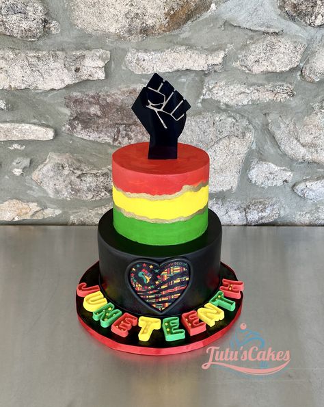 This cake has a little of every type of decoration. Black fist was made of card stock. Top-tier is a multi color American buttercream. Bottom tier is covered in black marshmallow fondant. Heart is an edible image, and marquee lettering is marsmallow fondant Juneteenth Cupcake Ideas, Juneteenth Cupcakes, Juneteenth Party Ideas, Juneteenth Cake Ideas, Juneteenth Food Ideas, Juneteenth Cake, Juneteenth Decoration Ideas, Juneteenth Crafts, Juneteenth Decorations