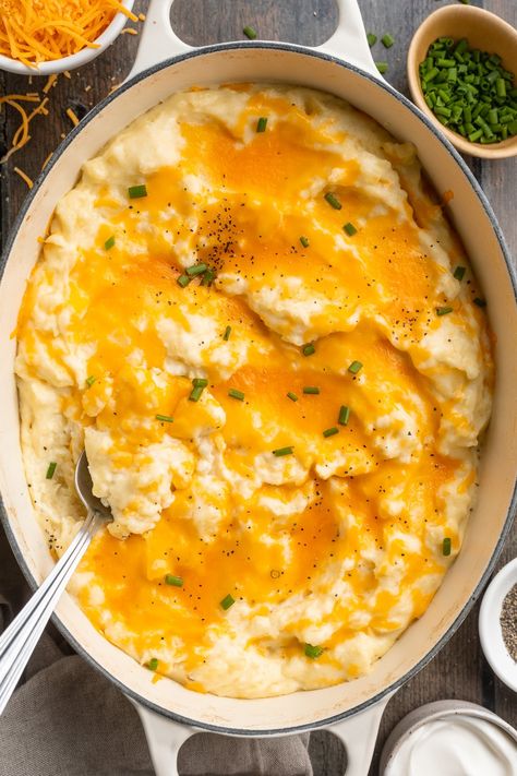 Buttery, fluffy, cheesy mashed potatoes are irresistibly delicious. Made with cream cheese, milk, sour cream, and butter, and topped with melty shredded cheddar cheese, they're the perfect dish to accompany a holiday turkey, a comforting meatloaf, or sweet and smoky grilled ribs. Guaranteed to be a favorite around the dinner table! Mashed Potatoes Aesthetic, Potatoes Aesthetic, Grilled Ribs, Cream Cheese Fruit Dip, 40 Aprons, Best Baked Potato, Air Fryer Baked Potato, Easy Skillet Meals, Cheesy Mashed Potatoes