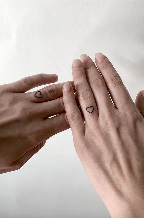 Tattoo For Couples Who Don't Need An Engagement Ring To Seal Their Love.  How do you prove your love to your significant other?   Couples marriage ring tattoos to prove your love. Marriage Ring Tattoos, Marriage Tattoos, Infinity Couple Tattoos, Wedding Band Tattoo, Heart Couple, Tattoo Wedding Rings, Finger Tattoo For Women, Ring Finger Tattoos, Marriage Ring