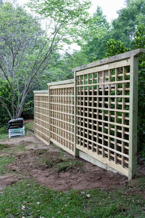 Installed garden trellis before adding, plantings, solar lanterns, and hanging planters Pagar Modern, Garden Screen, Hiding Ugly, Diy Garden Trellis, Diy Trellis, Garden Screening, Wooden Lanterns, Wooden Fence, Solar Garden