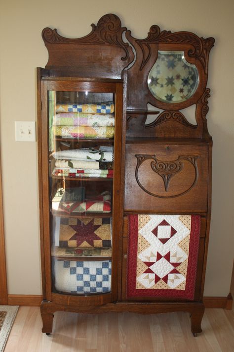 Storing small quilts in the antique secretary my mom just gave me.  Still need to add some decorative items to the top shelf. Antique Secretary, Quilt Display, Quilt Rack, Quilts Decor, Quilt Storage, Old Quilts, Antique Quilts, Sewing Rooms, Small Quilts