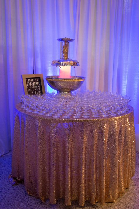 Wedding Colors Champagne, Fountain Wedding, Champagne Fountain, Gold Reception, Champagne Saucers, Purple Table, Purple Wedding Theme, Sequin Table, Black Gold Jewelry