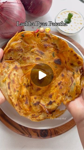 Prachi N on Instagram: "Lachha Pyaz ka Lachha Paratha - My most viewed one ever, with over 230 million views! 😲 I never expected it to do so well. 
Reposting this one today on the occasion of 1 year Anniversary of The Homely Shef🥇🎉 
Thank you all the love & support. I deeply appreciate it💖

Funny how things work; it might not even cross 100k today. It’s all about relativity, I guess! 🤷‍♀️✨

#foodie #paratha #recipe 
(Easy recipe, quick recipe, Indian food, paratha, breakfast, lunch, dinner ideas)" Paratha Breakfast, Lachha Paratha Recipe, Lunch Dinner Ideas, Lachha Paratha, Paratha Recipe, Recipe Indian, Most Viewed, 1 Year Anniversary, Quick Breakfast