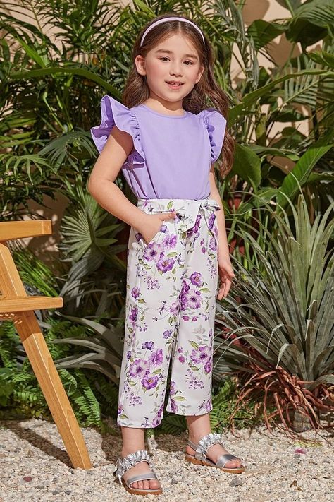 This top and pant set is cool and stylish. Butterfly sleeve, crew neck, floral print. #girls #top #pant #ruffle Two Piece Outfits Pants, Dolly Dress, Ruffle Trim Top, Baby Frock, Floral Print Pants, Dress Design Patterns, Girls Top, Butterfly Sleeve, Top And Pants Set