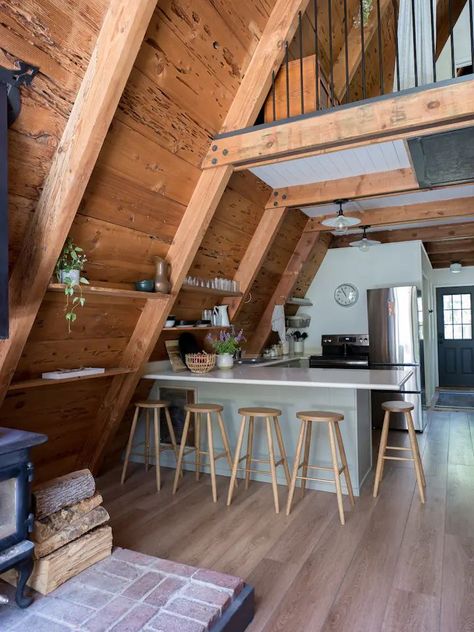 A Frame Cabin Loft Bedrooms, Cozy Aframe Cabin, A Frame Interior Kitchen, Lake House A Frame Interior, Custom A Frame Homes, A Frame Fireplace Ideas, A Frame Lake Cabin, A Frame Cabin Layout, Aframe Cabin Interiors