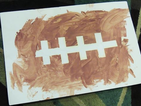 Tape Resist Football Painting #football #footballlessonplan #autumnlessonplan #falllessonplan #infant #toddler #childcare #childcarecourses #infantlessonplan Sports Lesson Plans, Football Painting, Football Paintings, Toddler Sports, Football Crafts, Sport Craft, Football Themes, Daycare Crafts, Preschool Theme