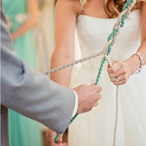 Instead of lighting the traditional unity candle during the ceremony, the couple opted to do a God's Knot, tied with the light mint green and ivory color themes of the day. The "knot" consisted of three strands, one to represent Cristin, one for Mike, and one for God - the meaning behind was that the couple ties their life in together and with God. Unity Braid, Cord Of Three Strands, Unity Ceremony, When I Get Married, Light Mint Green, Ceremony Ideas, Unity Candle, Wedding Wishes, Fairytale Wedding