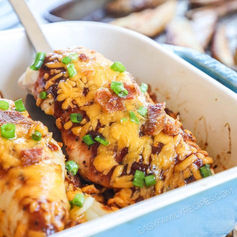 FAVE Family Dinner! Kid friendly and grown up approved, this easy chicken breast dinner is crowd pleaser! This Cheesy Bacon BBQ Chicken will remind you of your favorite smokehouse dish at Chilis! Made with tender chicken breast, topped with tangy BBQ sauce, then smothered in cheese and crispy crumbled bacon all baked right over sweet onions for the best one pan dinner recipe. Leftover Bbq Chicken Recipes, Easy Chicken Breast Dinner, Bacon Bbq Chicken, One Pan Dinner Recipes, Bbq Chicken Breast, Cheesecake Vegan, Baked Bbq Chicken, Sweet Onions, Easy Chicken Breast