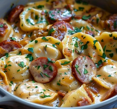 This Cheesy Kielbasa and Pierogi Skillet is a comforting and flavorful meal that brings together smoky kielbasa, tender pierogis, creamy sour cream, and melty cheddar cheese. It’s an ideal one-pan dinner that’s easy to prepare, making it perfect for busy weeknights or cozy family gatherings. The addition of sauerkraut adds a tangy twist, but it’s entirely optional based on your taste. With minimal ingredients and quick prep, this dish delivers satisfying flavors with every bite. Kielbasa And Pierogies, Crockpot Pierogi Casserole, Pierogi Casserole With Kielbasa, Ham Casseroles, Pierogies And Kielbasa, Cheesy Kielbasa, Kielbasa Pasta, Pierogi Casserole, Perogies Recipe