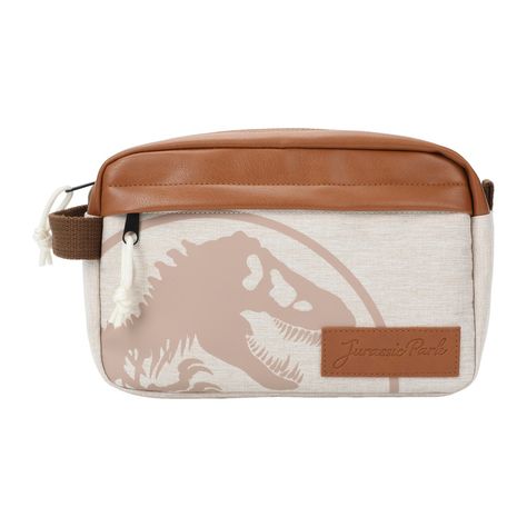 Embark on your Jurassic Park adventure with the "Jurassic Park Park Ranger Travel Cosmetic Bag," an officially licensed and must-have accessory for fans of this iconic dinosaur franchise. Featuring a striking PU (polyurethane) applique with debossed details, this bag proudly displays the legendary Jurassic Park logo and theme, making it the perfect choice for dinosaur enthusiasts. Designed for convenience, it comes with a sturdy side handle strap for easy carrying and transport on your journeys. Jurassic Park Logo, Jurassic Park World, Park Ranger, A Dinosaur, Iconic Bags, Makeup Bags Travel, Travel Cosmetic Bags, Jurassic World, Jurassic Park