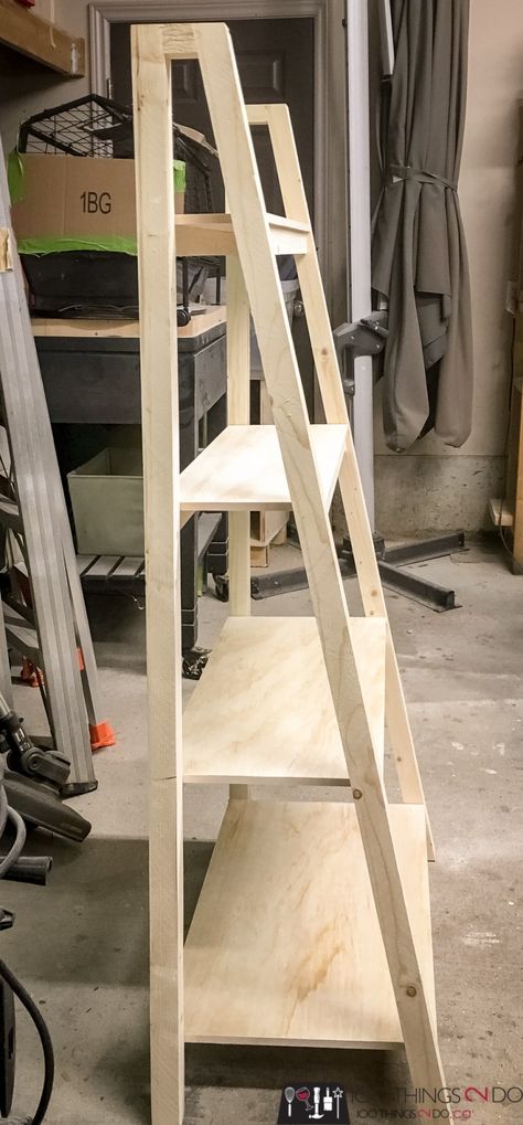 Freestanding, Angled Bookcase - free building plans! | 100 Things 2 Do Pallet Ladder Shelf Diy, Plant Shelf Freestanding, Diy Plant Ladder Shelf, Build Ladder Shelf, Build A Ladder Shelf, Diy Wooden Ladder Shelf, Ladder Shelf Plans Diy, Angled Bookcase Diy, Diy Wood Ladder Shelf