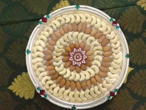 Photo #1 from Sara Decor's "Portfolio" album Nuts Plate Decoration, Marriage Plate Decoration, Dry Fruits Plate Decoration Ideas, Coconut Plate Decoration, Wedding Plates Decoration Indian, Plate Decorations Engagement, Plate Decoration Wedding Indian, Sattu Decoration, Wedding Thali