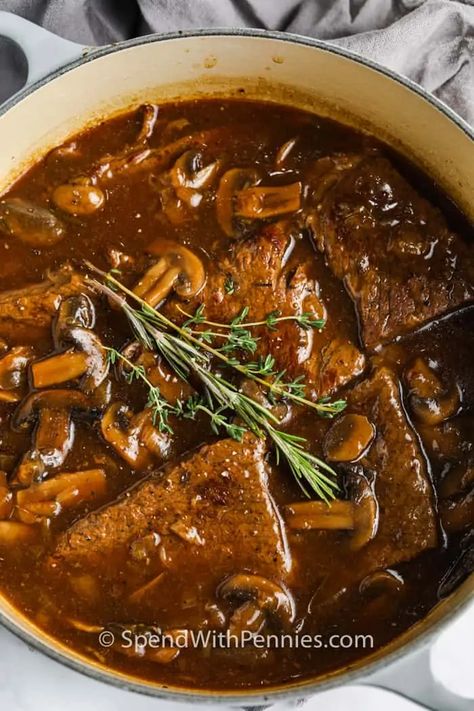 Just 20 minutes of prep time is all it takes to cook this tasty Round Steak and Gravy recipe! Then it's slow-cooked in the oven until fork-tender. #spendwithpennies #roundsteakandgravy #steakandgravy #entree #recipe #classic #stovetop #tender #mushrooms #onions