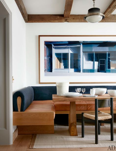 An Axel Einar Hjorth dining table with a Charlotte Perriand chair and custom banquette create a kitchen breakfast nook. Photo-graph by Wim Wenders. Booth Dining, Seating In Kitchen, Banquette Ideas, Banquette Seating In Kitchen, Dining Banquette, Kitchen Banquette, Booth Seating, Banquette Seating, Kitchen Benches