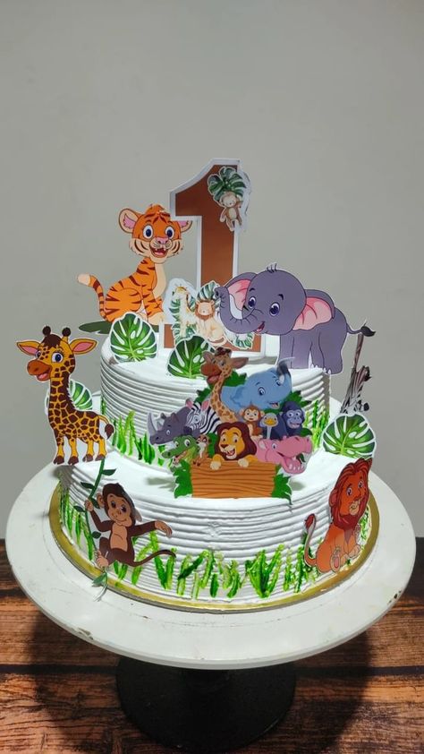 Cake for kids based on jungle theam. 1st birthday cake🥰 Cartoon Theme Cake For Boys, Jungle Theme Cake Boys, Safari Cake Design, Jungle Cake Ideas, Cartoon Cakes For Kids, Cartoon Theme Cake, Jungle Theme Birthday Cake, Jungle Theme Cake, Cakes Without Fondant