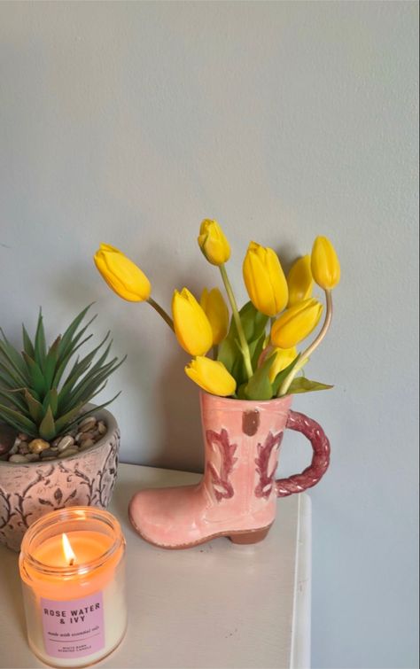 flowers in a cowboy boot vase candle plants tulips rose water! Cowboy Boot Candle, Cowboy Boot Flower Vase, Plants Tulips, Clay Flower Vase, Cowboy Boot Vase, Cute Vases, Boot Vase, Newspaper Crafts Diy, Candle Plant