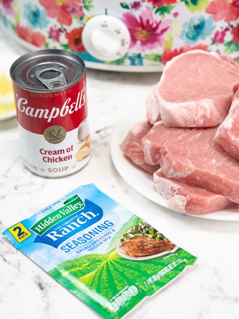 Looking for an easy and delicious Slow Cooker meal? Look no further than these Slow Cooker Ranch Pork Chops! Tender, juicy pork chops are smothered in a creamy ranch flavored sauce and cooked to perfection in the slow cooker. This recipe is sure to please even the pickiest of eaters, and it's so simple that anyone can make it! #slowcooker #porkchops #ranch Cream Of Chicken Pork Chops Crockpot, Crockpot Pork Chops With Ranch Seasoning, Crockpot Pork Chops Cream Of Chicken, Pork Chop Recipes Crockpot Ranch, Best Crock Pot Pork Chops, Crock Pot Ranch Pork Chops And Potatoes, Crockpot Porkchop And Rice, Pork Ranch Crockpot, Ranch Smothered Pork Chops