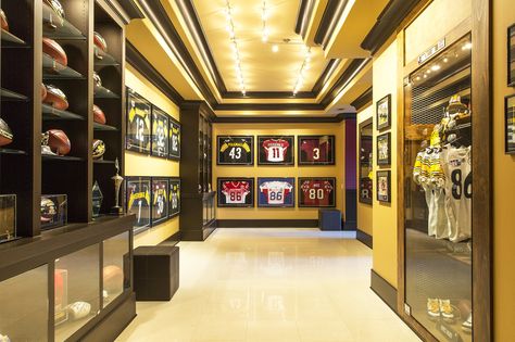 The trophy room of retired football player Hines Ward at his home in Atlanta. OK, it's beautifully done and over the top - but the intent to surround yourself in well-done displays that conjure great memories is wonderful. Basketball Trophy Display Ideas, Trophy Room Ideas, Jordan 1 Trophy Room, Nfl Watch Room, Sports Memorabilia Room, Sports Room Man Cave, Headquarters Design, Badminton Quotes, Hines Ward