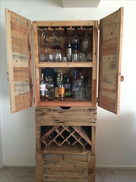 My liquor cabinet is finally finished!  Every pic on this board contributed to the making of this... A couple hours at a time, over the last year with mostly hand tools and a crapload of pallets.  Done! Pallet Liquor Cabinet, Liquor Cabinet Ideas, Diy Liquor Cabinet, Liqour Cabinet, Wine Cabinet Design, Diy Liquor, Pallet Deck Diy, Cabinet Plans, Diy Accent Wall