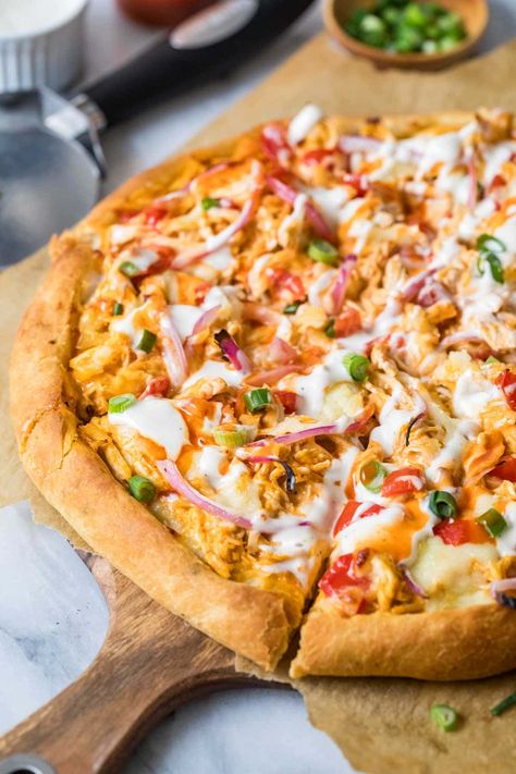 Spice up pizza night with a homemade buffalo chicken pizza! Zesty buffalo sauce, ranch, onions, and plenty of stretchy cheese make this one flavorful pie. Recipe includes a how-to video! Buffalo Flatbread Pizza, Red Sauce Pizza, Vegetables Pizza, Homemade Buffalo Chicken Pizza, Buffalo Pizza, Buffalo Chicken Lasagna, Buffalo Chicken Pizza Recipe, Buffalo Chicken Pasta Salad, Deep Dish Pizza Recipe