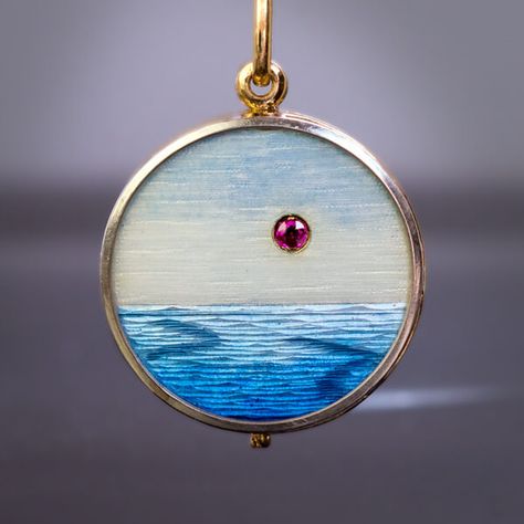 The front of this unusual antique 18K gold slide locket pendant features a guilloche enamel sea view accented by a ruby. The surface covered with silverish blue enamel, is skillfully engraved to imitate sea waves and a cloudy sky. The wave pattern changes depending on the perspective. The interior of the pendant is Bower Bird, Enamel Locket, Art Nouveau Necklaces, Gold Orchid, Gold Slides, Art Nouveau Antiques, Art Nouveau Flowers, Guilloche Enamel, Art Nouveau Pendant