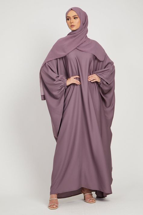 A classic modest batwing abaya suitable for all shapes and sizes. Perfect for everyday wear and school/university. Made using light weight nidha fabric making it super comfortable and ideal for all seasons. Ideal for Hajj/Umrah. Fabric - Premium Nidha (100% polyester, light weight & soft) Elasticated Cuff Matching hijab is included Model is a UK dress size 8, height of 5'8 and wearing a size 58 Hand Wash Only Batwing Abaya, Latest Abaya Designs, Stylish Abaya, Butterfly Abaya, Modest Wardrobe, Outfits Modest, Abaya Designs, Dubai Fashion, Fabric Making