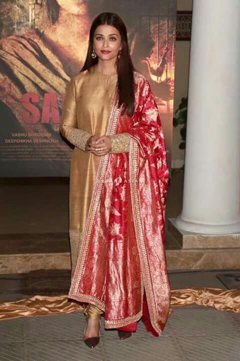 Aishwarya looks beautiful in golden n red dress Sabyasachi Dresses, Golden Suit, Indian Kurti Designs, Indian Designer Suits, Casual Indian Fashion, Kurti Designs Party Wear, Dress Indian Style, Stylish Dresses For Girls, Indian Designer Outfits