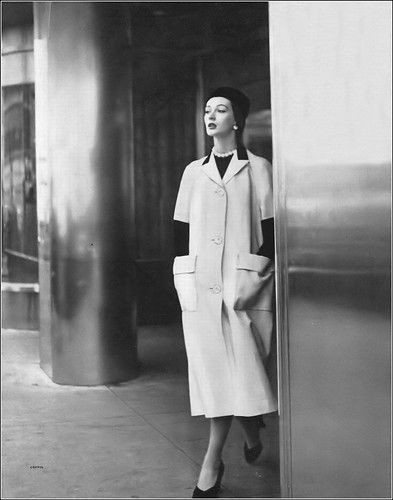 Dovima in white Irish linen short-sleeved duster with bold strokes of black velvet and a black cotton broadcloth lining by Traina-Norell, photo by Clifford Coffin, Vogue, August 15, 1950 Clifford Coffin, Traina Norell, 1959 Fashion, Norman Norell, Suzy Parker, Linen Short, Irish Linen, April 15, Fashion Images