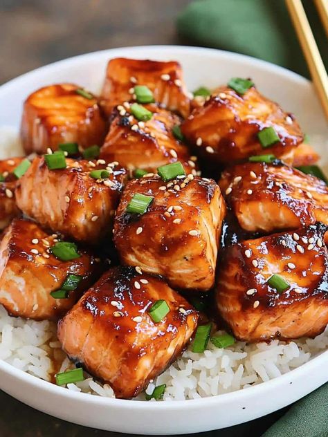 These honey garlic salmon bites are a quick and delicious option for dinner. Coated in a sticky honey garlic glaze, they’re perfect served over white rice for a flavorful meal. Honey Garlic Salmon Bites, Chicken Chipotle Pasta, Garlic Salmon Bites, Spicy Chicken Chipotle Pasta, Honey Garlic Glaze, Chipotle Chicken Pasta, Chicken Chipotle, Chipotle Pasta, Chipotle Copycat Recipes