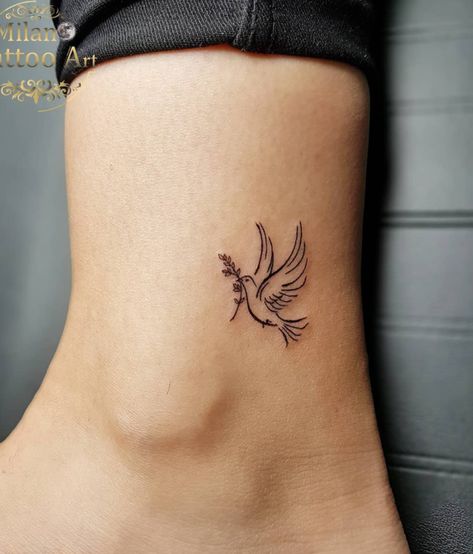 Pretty Dove Ankle Tattoo Idea Bird Tatoos Woman Wrist, Small Dove Tattoo Design For Women, Dove With Olive Branch Tattoo Simple, Angel Tattoo Placement, Dove Flying Tattoo, Mini Tattoos Christian, Fe Tattoos For Women, Tiny Angel Wing Tattoo, Dove Hand Tattoo