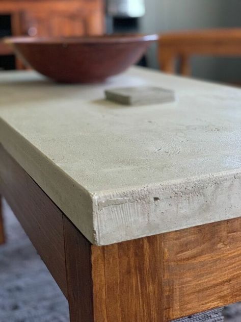 Stylish yet rugged, but beautiful coffee table in just a few steps!!Here is how I made my concrete coffee table, First make a mold out of milamin wood. The size is up to you. This one is 500mmx1000mmx45mm. Put silicone inside along the edges. Before pouring the concrete make sure that the mold is very clean and level. Then spray cooking spray inside the mold, or you can use olive oil, just to prevent the concrete from sticking to the mold. This is just to show the reinforcement I us… Concrete Top Console Table, Wood And Concrete Coffee Table, Cement Table Top Diy Outdoor, Diy Metal Coffee Table, Diy Outdoor Concrete Coffee Table, Making A Concrete Table Top, Concrete Top Coffee Table, Concrete Desk Top, Concrete Overlay Table