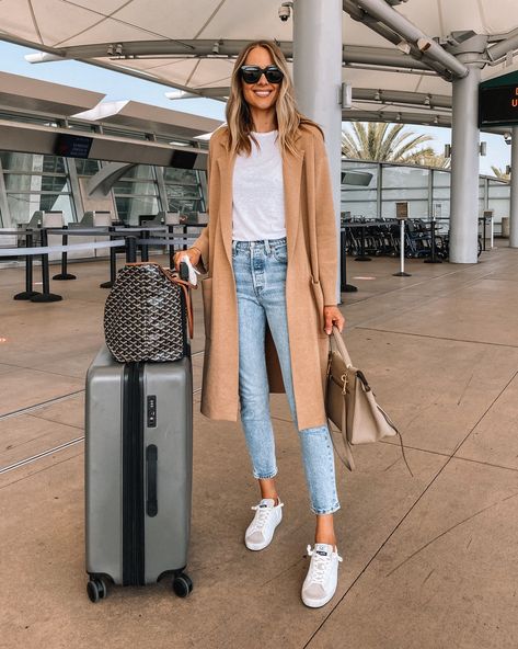 Fashion Jackson Travel Outfit Camel Coatigan White Tshirt Denim Jeans White Sneakers Jeans Travel Outfit, Coatigan Outfit, Airport Outfit Spring, Mom Jeans Outfit Winter, Celine Belt, Camel Coat Outfit, Comfy Travel Outfit, Main Character Energy, Airport Outfits