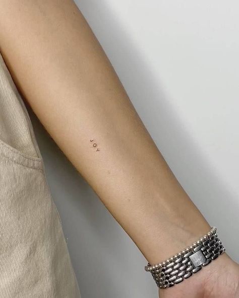 Minimalist Tattoo Arms Women, Words Tattoo Minimalist, Fine Line Back Of Arm Tattoo, Count It All Joy Tattoo, Minimalistic Arm Tattoo, Choose Joy Tattoo, Mini Tattoos Arm, Joy Tattoo Ideas, Joy Tattoo