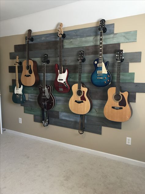 Decorate With Guitars, How To Display Guitars, Bedroom Ideas Guitar, Decorating With Guitars, Guitars Hanging On Wall, Display Guitars On Wall, Guitar Home Decor, Guitar Bedroom Ideas, Guitar Display Ideas