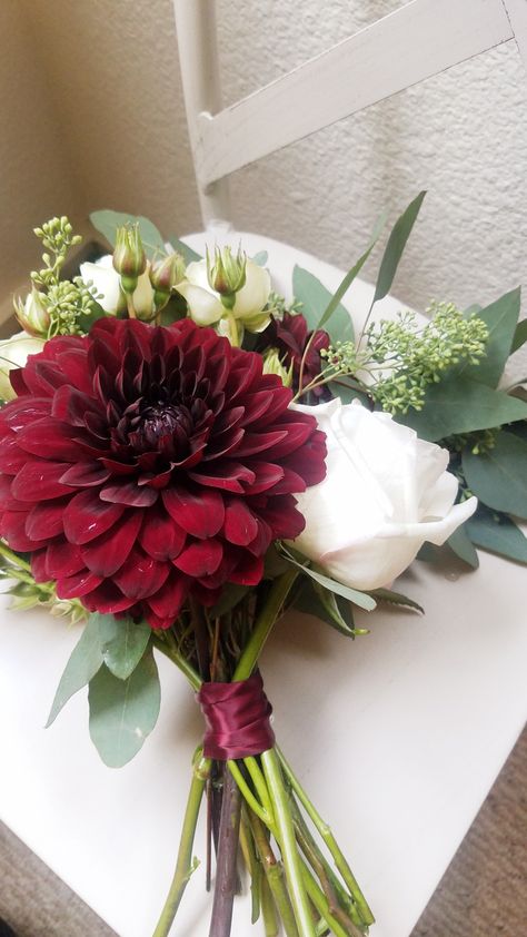 Bridesmaid bouquet with white flowers, eucalyptus and burgundy dahlias. #seededeucalyptus #bridesmaid #bouquet #willowandpinefc #localflorist #flowers Flowers To Go With Burgundy Dress, Burgundy Flower Bouquet Bridesmaids, Small Bouquet Wedding Bridesmaids, Burgundy Bridal Flowers, Burgundy And Sage Bouquet, Burgundy Dahlia Bouquet, Small Bridesmaid Bouquet Fall, Red Prom Flowers Bouquet, Burgundy Bouquet Bridesmaid