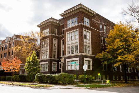 This West Village apartment building is a beautiful old red brick, with white trim and ornate details along the roof line. Click through for more images of this classic Detroit apartment building. Small Town Apartment Building, Apartment Building Architecture, Detroit Apartment, Apartment Building Exterior, West Village Apartment, Small Apartment Building, Detroit Art, San Myshuno, Apartment Exterior