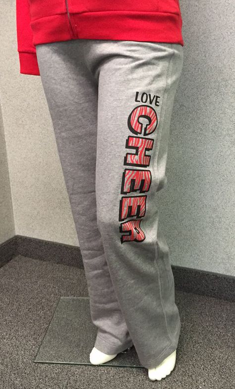 Learn 4 places to add custom designs to sweat pants. Shown: "Love Cheer" custom apparel using layout QLG-31. TransferExpress.com Iron On Sweatpants Ideas, Cheer Pants Ideas, Custom Sweatpants Ideas, Vinyl Sweatpants Ideas, Htv Placement On Sweatpants, Cricut Sweatpants Ideas, Clothes Sweatpants, School Team Shirts, First Day Of Autumn