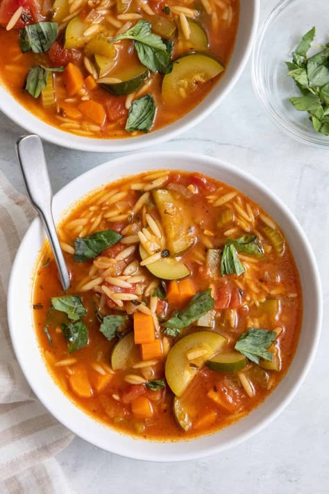 This Orzo soup recipe is full of veggies, including zucchini, carrots, and tomatoes. It's made with all vegetarian ingredients - perfect for meatless Monday | Orzo Soup | Vegetarian Soup Recipe | Light Soup Recipe | Zucchini Soup Recipe | Winter Meals | Cold Weather Dinners | Spicy Zucchini Soup, Vegan Orzo Recipes, Soups Vegetarian, Vegetarian Vegetable Soup, Vegetarian Tortilla Soup, Zucchini Soup Recipes, Orzo Soup Recipes, Hearty Soup Recipes, Orzo Soup