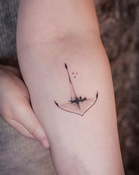 67 Meaningful Tattoos That You Won't Regret - Our Mindful Life Ocean Strength Tattoo, Dutch Tattoo Ideas For Men, Nautical Hand Tattoos For Women, Hammock Tattoo Ideas, Sailing Tattoo Ideas, Water Element Tattoo Ideas, Tiny Ship Tattoo, Grow Through It Tattoo, Light House Tattoo Minimalist