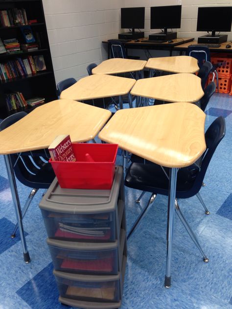 Groups of 6- you have to be creative with these weird trapezoid desks! Rolly carts at the end of each island ($10 from Target) easily store each blocks' notebooks, folders, etc. Student Desks Arrangement, Classroom Desk Arrangement, Desk Arrangement, Classroom Seating Arrangements, Primary School Classroom, Desk Arrangements, Classroom Arrangement, Classroom Style, Classroom Desk