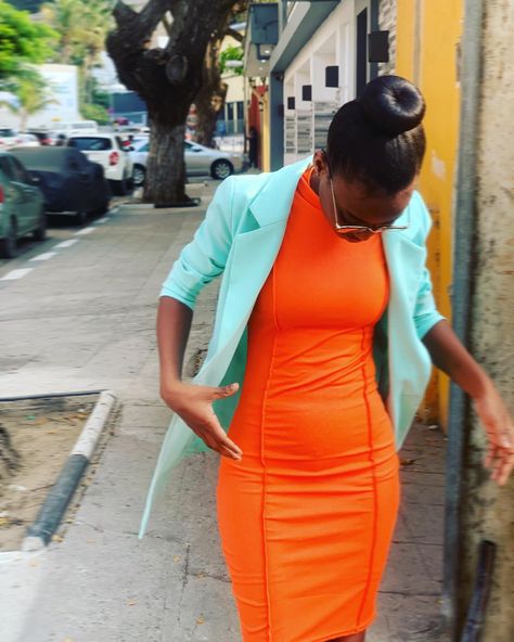 A black girl standing by the side of the road, looking down at her orange fit on dress , she is wearing a light blue blazer and has a bun hairstyle. Orange Blazer Outfits, Light Blue Blazer, Orange Purse, Wedding Decor Photos, Orange Blazer, Orange Fits, Dress Light Blue, Beige Blazer, Blazer Outfits