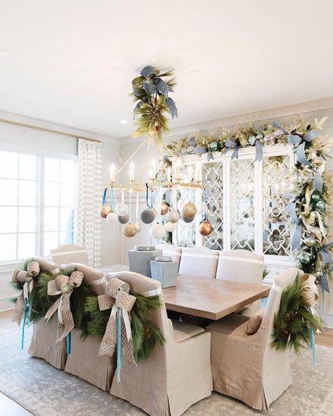 John Mark Sharpe on Instagram: "Merry Christmas from this fabulous dining room! Dress up your chairs with these pine wreaths and a simple bow! You can find them @johnmarkenterprises! Pictures by: @annabellacharles Interior Design by: @warehouse67design Home builder: @johndukehomes Realtor: @elizabethdukerealtor Home Show: @vestahomeshow Magazine: @athomemagazine" Christmas Dining Room Chair Decor, Christmas Wreath Dining Chairs, Pine Wreaths, Xmas Recipes, Simple Bow, Chair Bows, Christmas Chair, Christmas Dining Room, Holiday Home Tour