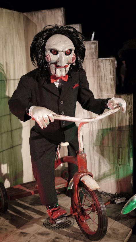 Billy the Puppet - Saw franchise Kick him off his bike and run! Billy The Puppet Wallpaper, Saw Characters, Jigsaw Billy The Puppet, Saw Billy Puppet, Billie Eilish Lyrics Wallpaper, Billy Jigsaw, Jigsaw Puppet, Billy Puppet, Saw Puppet