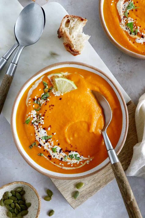 This luscious ginger carrot soup with lime is healthy, comforting, with a subtle and refreshing spicy kick. Ginger Carrot Soup, Vegan Thanksgiving Main Dish, Carrot Coconut Soup, Thanksgiving Main Dish, Savory Granola, Thanksgiving Mains, Homemade Sandwich, Comfort Desserts, Soup Easy