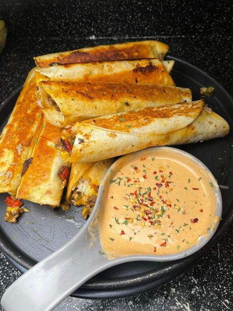 Cheesy Beefy Roll-Ups Beefy Cheesy Roll Ups, Cheesy Roll Ups Taco Bell, Taco Roll Ups Tortilla Ground Beef, Cheesy Beefy Rollups, Ground Beef Blackstone, Cheesy Beef Roll Ups, Ground Beef Roll Ups, Cheap Blackstone Meals, Cheesy Roll Ups