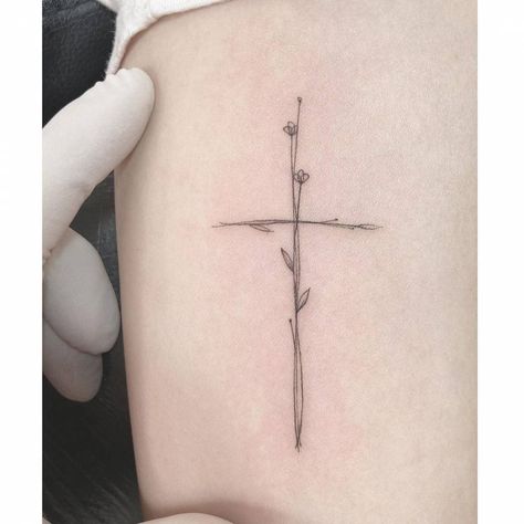 Cross Of Flowers Tattoo, Cross Wildflower Tattoo, Wildflower Bible Verse Tattoo, Small Cross Flower Tattoo, Cross Verse Tattoo, Minimalist Arm Tattoos For Women Forearm, Small Bible Tattoos For Women, Fine Line Bible Tattoo, Cross With Tulips Tattoo