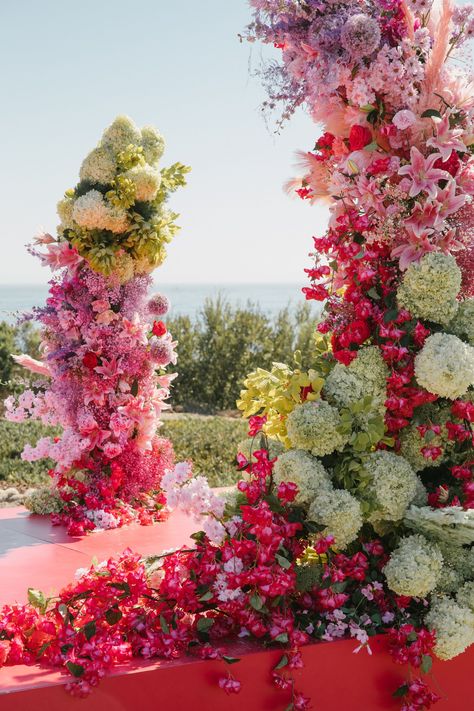 bold pink and green floral towers for an edgy and whimsical outdoor wedding ceremony Large Floral Installations, Colorful Wedding Altar, Bold Wedding Decor, Alter Wedding Decorations, Flower Altar, September Wedding Flowers, Reception Table Centerpieces, Wedding Flower Trends, Floral Installation