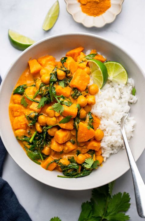 Sweet Potato Curry with Chickpeas is a perfect cold weather meal, with tender sweet potatoes and protein-packed chickpeas swimming in an aromatic and creamy red curry sauce. Easy to make in one pan! Potato Chickpea Curry, Curry With Chickpeas, Sweet Potato Chickpea Curry, Potato Chickpea, Butternut Squash Curry, Red Curry Sauce, Chickpea Curry Recipe, Vegan Curry Recipes, Sweet Potato Curry