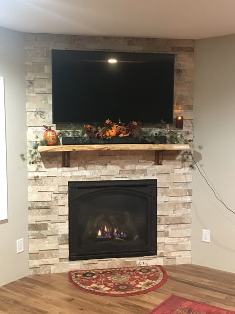 Gas Fireplace For Corner, Farmhouse Gas Fireplace With Tv, Corner Fireplace In Basement, Build Corner Electric Fireplace, Corner Stone Fireplace With Tv, Corner Fireplace Basement Ideas, Diy Electric Fireplace Corner Wall, Stone Wall Fireplace With Tv Corner, Corner Fireplace Mantle Decor With Tv